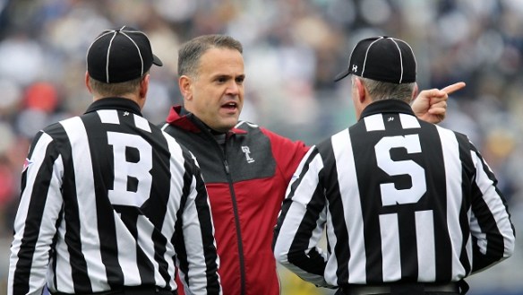 Click on the photo of two refs telling Matt Rhule what they think calling a timeout on fourth and 20 prior to a punt is ....