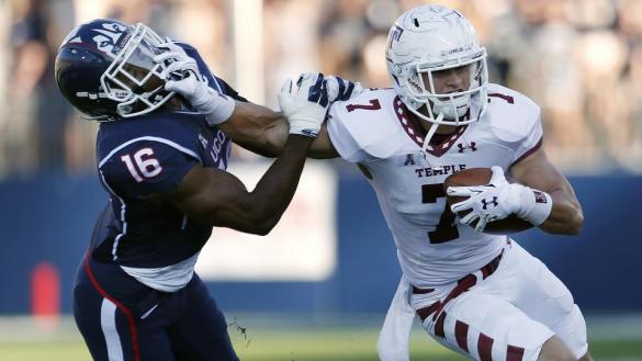 Temple wide receiver John Christopher (7) stiff-arms first-round NFL draft choice Byron Jones (16) 